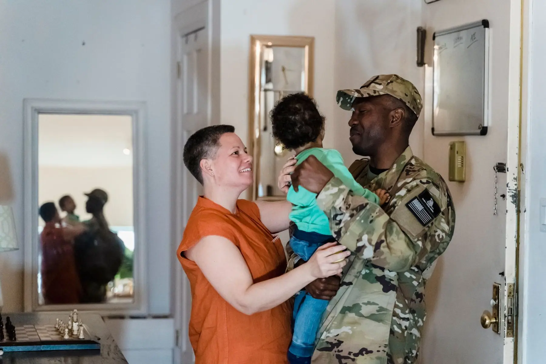 Service member at home with his family